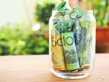 Australia cash in glass piggy bank for savings money concept