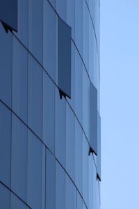 Low angle view of modern building against clear sky