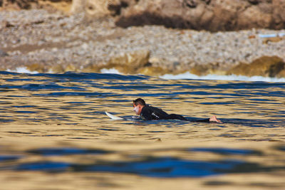 Portrait of man swimming in sea