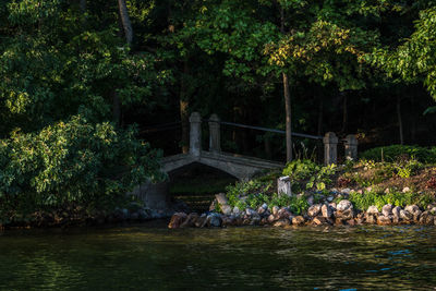 People relaxing on riverbank