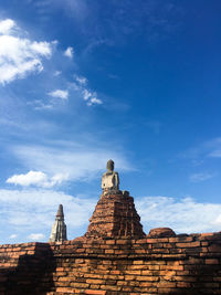Low angle view of old temple against blue sky
