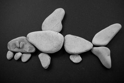 High angle view of stones against black background