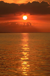 Scenic view of sea against romantic sky at sunset