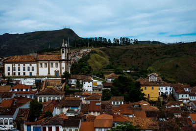 Buildings in town against sky