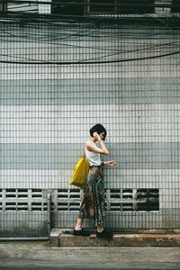 Woman standing on the road