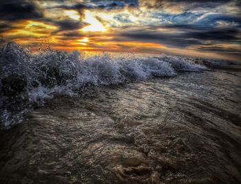 Scenic view of sea against cloudy sky