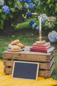 Stack of books on table in field