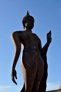 Low angle view of statue against clear blue sky