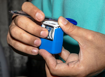 Close-up of man holding hands