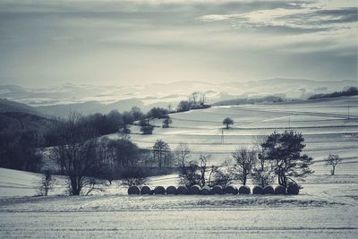 Scenic view of mountains against cloudy sky