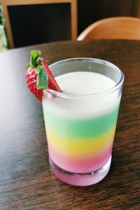 Close-up of multi colored drink served on table