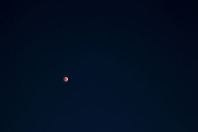 Scenic view of moon against clear sky at night