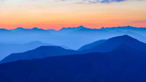 Scenic view of mountains against sky during sunset