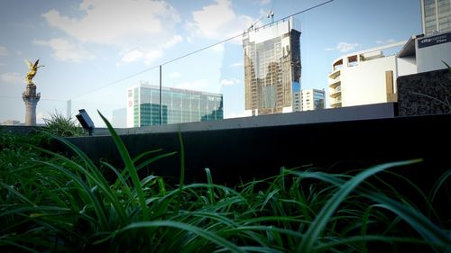 Low angle view of buildings in city against sky