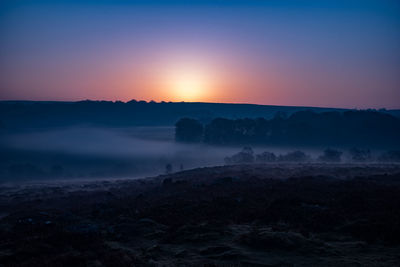 Scenic view of silhouette landscape against sky during sunset