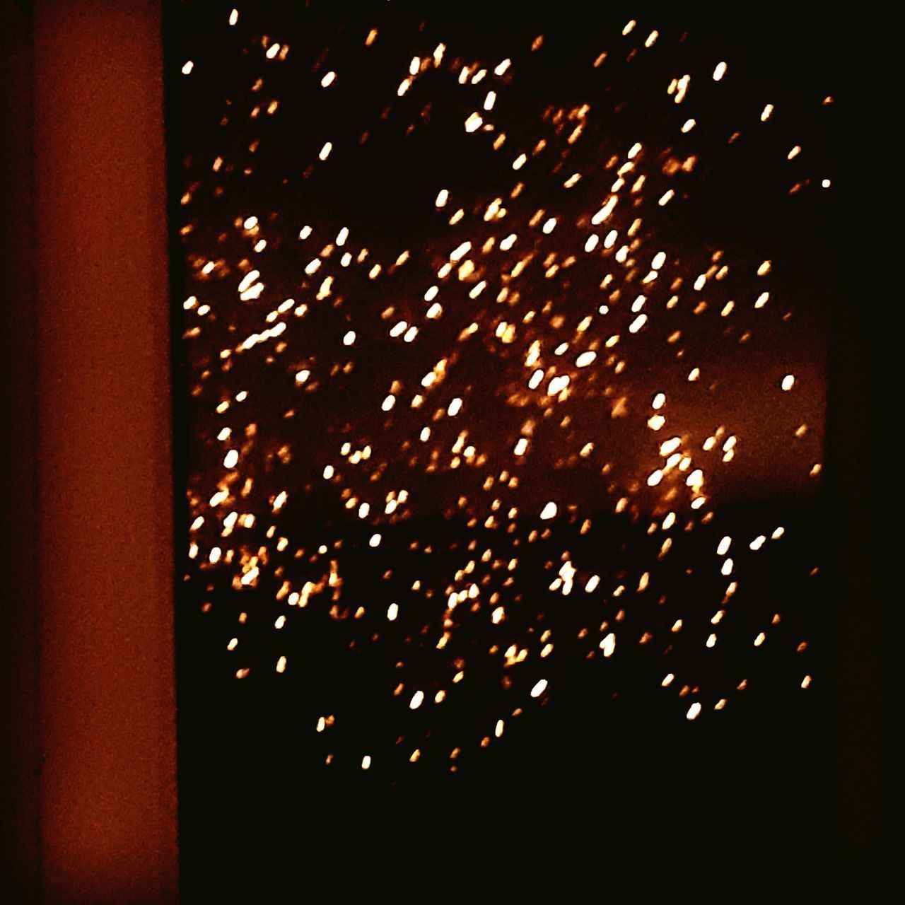 LOW ANGLE VIEW OF FIREWORK DISPLAY IN SKY AT NIGHT