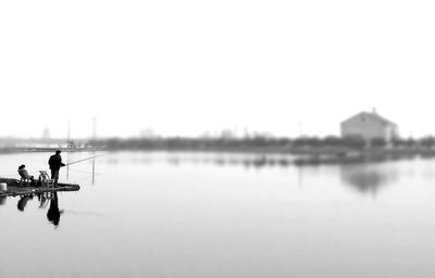 Reflection of woman in water