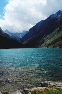 Scenic view of lake and mountains against sky