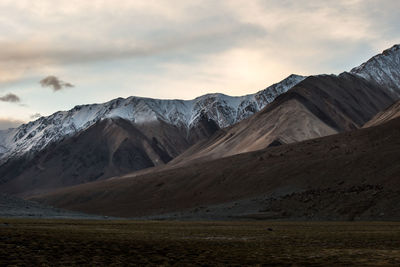 Scenic view of mountains against sky during sunset