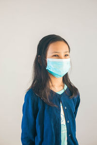 Portrait of a beautiful young woman over white background