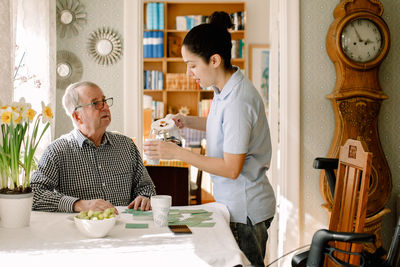 Man and woman sitting at table