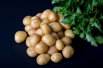 Close-up of potatoes against black background