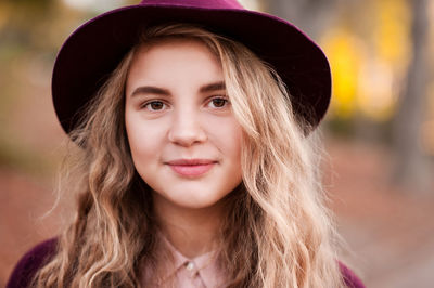 Portrait of smiling woman wearing hat