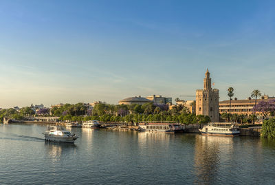 View of the guadalquivir river and the torre del oro, seville, spain