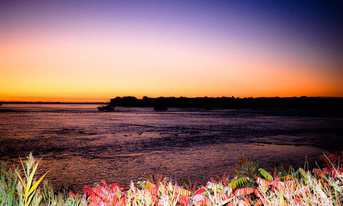 Scenic view of sea against sky during sunset