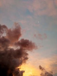 Low angle view of dramatic sky during sunset