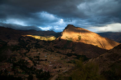 Scenic view of mountain against cloudy sky