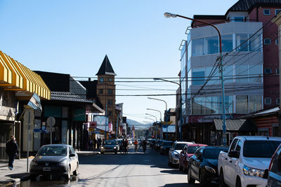 View of city street and buildings against sky