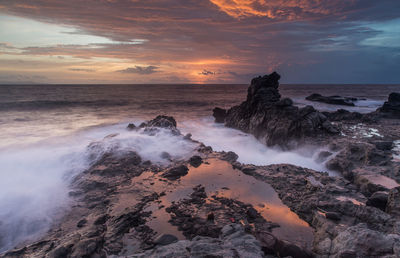 Scenic view of sea against sky during sunset