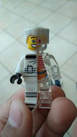 Close-up of hand holding toy toys