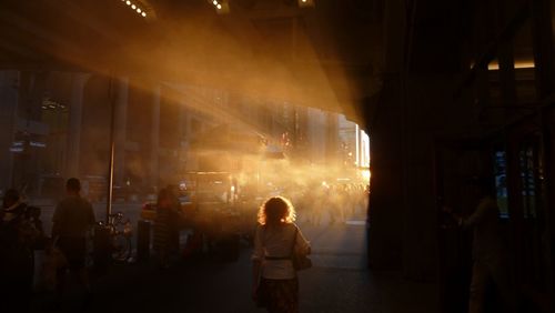 People at grand central station on sunny day