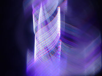 Multi colored light painting against black background