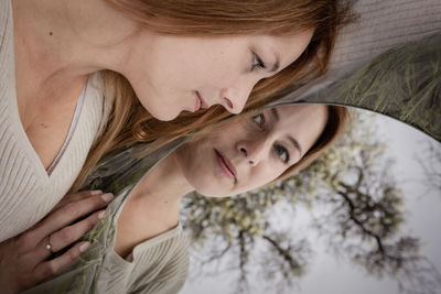 Close-up of young woman looking away
