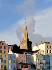 Low angle view of buildings in city against sky