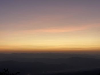 Scenic view of silhouette landscape against romantic sky at sunset