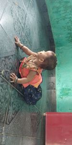 High angle view of cute girl in swimming pool