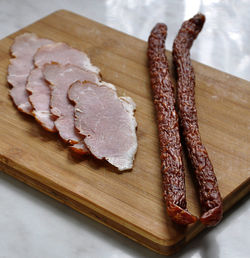 High angle view of meat on cutting board