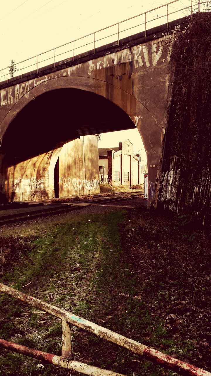 bridge - man made structure, transportation, connection, built structure, architecture, railroad track, engineering, rail transportation, arch, arch bridge, bridge, metal, public transportation, travel, day, mode of transport, outdoors, river, railing, high angle view