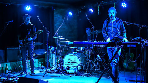 Panoramic shot of illuminated lights at music concert