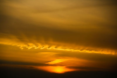 Low angle view of dramatic sky during sunset