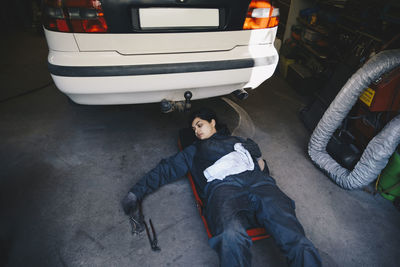 High angle view portrait of boy on car