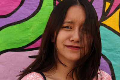 Close-up portrait of a smiling young woman