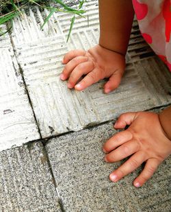 Low section of woman with hands