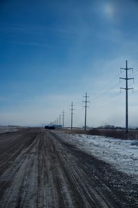 Country road against clear sky