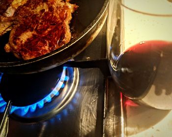 Close-up of meat on barbecue grill