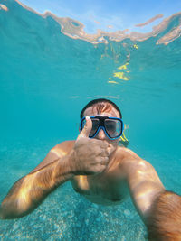 Man swimming in sea